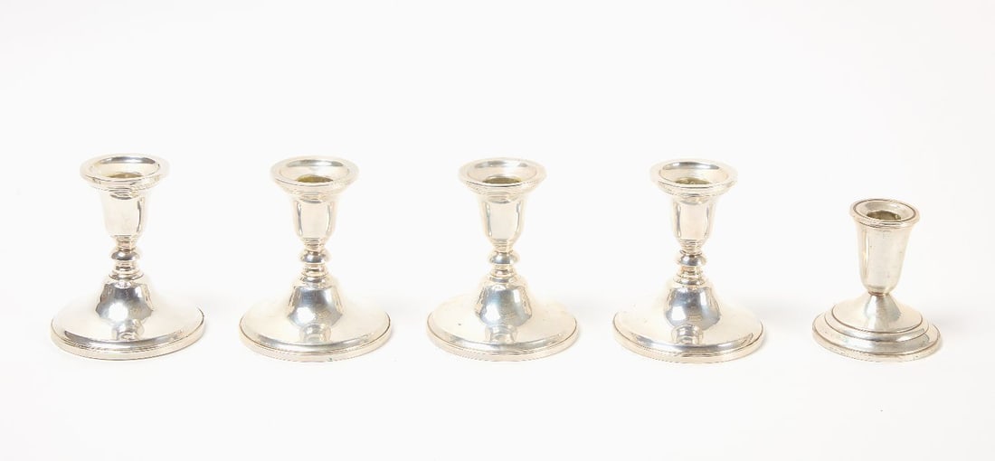 Five Sterling Weighted Candlesticks: Five sterling weighted candlesticks. H 3-3/8 in. and H 4-1/8 in. Total Weight: 45.555 ozt.