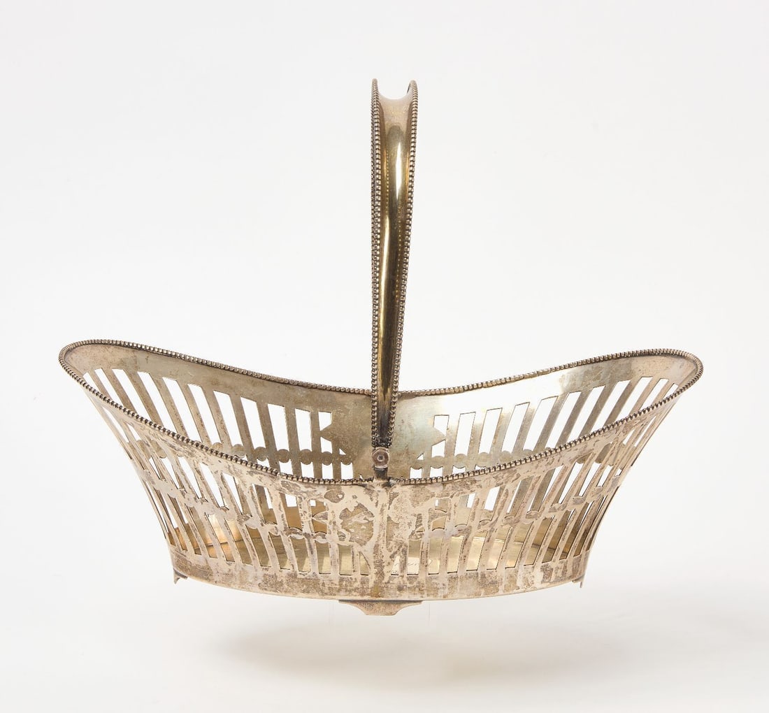 Silver Handled Basket: 81% silver (XRF tested) handled basket. Beaded edge around top and both sides of handle. Weight: 15.625 ozt.(Handle Up): H 10-1/4 in. L 12-1/2 in. W 6-1/4 in.Provenance: Abbey Galleries (Brooklyn, NY)
