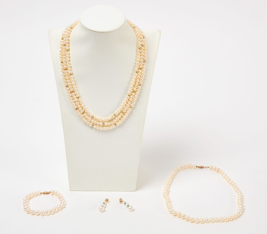 Group of 14K Gold-Mounted Pearl Jewelry: Group of 14k gold-mounted pearl jewelry. Includes pair of cultured pearl and emerald drop earrings with 14k settings, a necklace and bracelet set with 14k clasps, and a 3-strand pearl necklace with 14