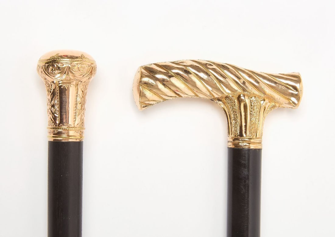 Two Gold-Filled Walking Sticks: Two gold-filled walking sticks. Ebonized wood shafts. Late 19th-early 20th century. Both L 34-3/4 in.