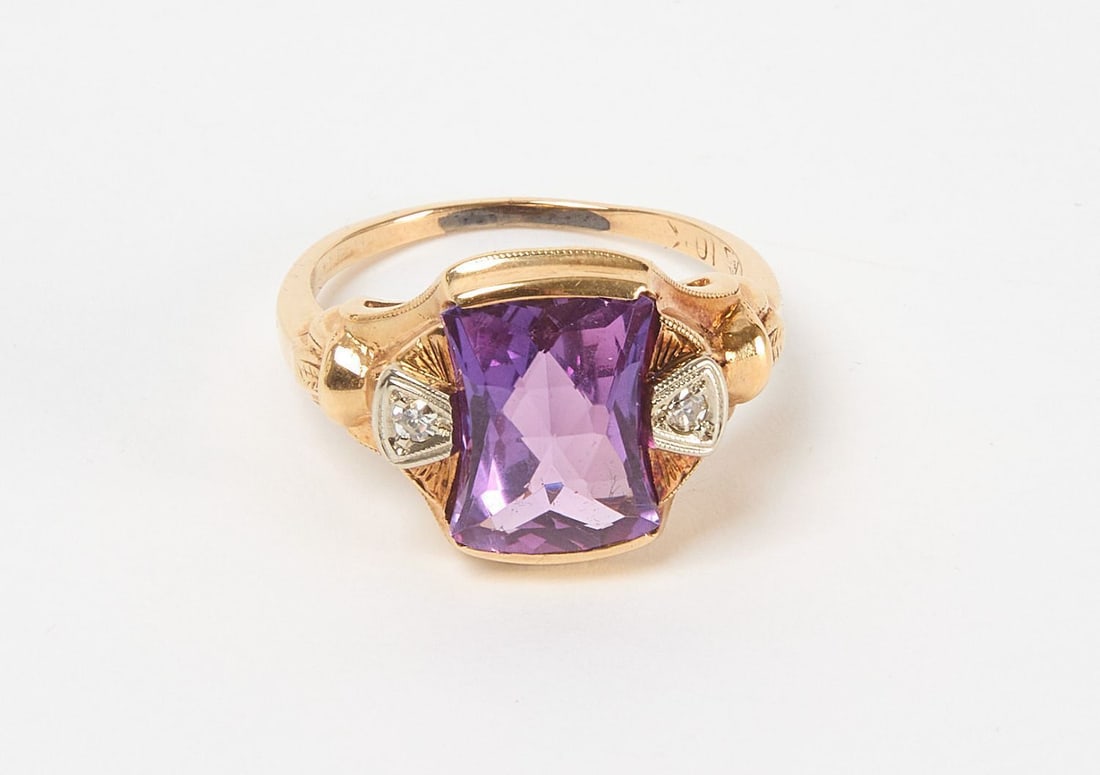 10k Gold Ring with Amethyst: 10k gold ring with large amethyst flanked by 3 melee diamonds on either side. 2.6 dwt. Size 6-1/2.
