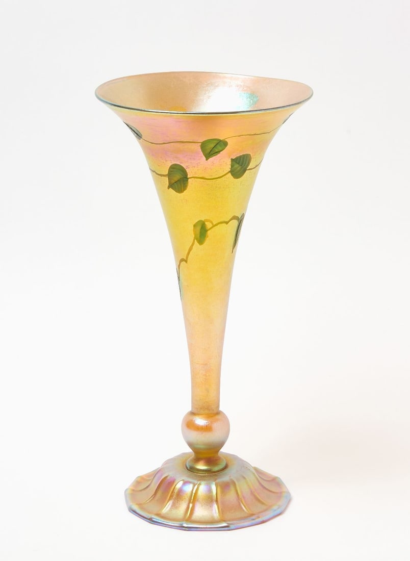 Tiffany Studios Favrile Glass Vase with Trailing Vine: Tiffany Studios Favrile glass trumpet vase. Iridescent finish with trailing leaf/vine decoration. Signed on base 'L.C.Tiffany - Favrile' with numbers '1535 / 1228 M.' American, circa 1