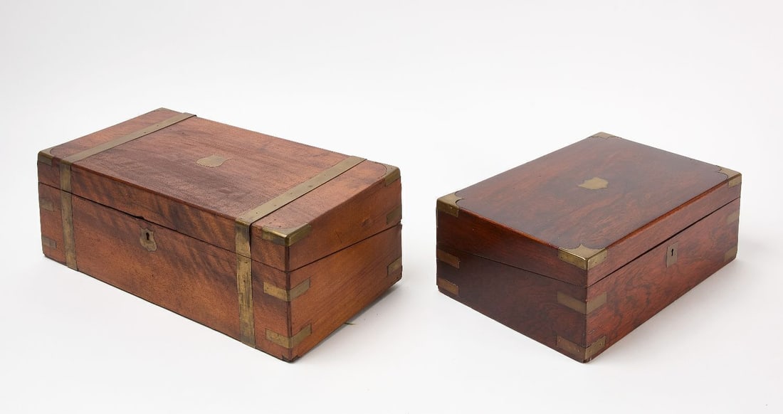 Two Brass-Mounted Writing Desks: Two brass-mounted writing desks. Walnut or Mahogany. English, 19th century. H 6-1/2 in. W 19-5/8 in. D 9-3/4 in. H 5-1/2 in. W 16 in. D 10 in. 
