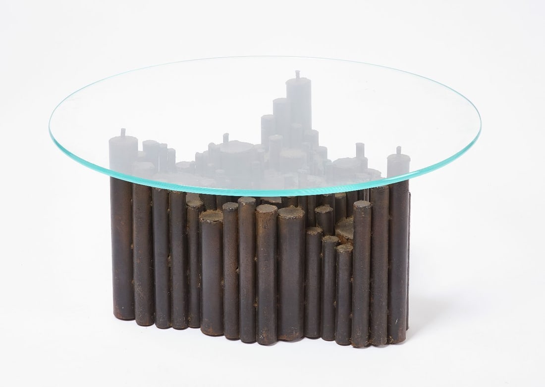 Brutalist Coffee Table: Brutalist coffee table. Iron base and round glass top. circa 1970. D 36 in. H 17 in.