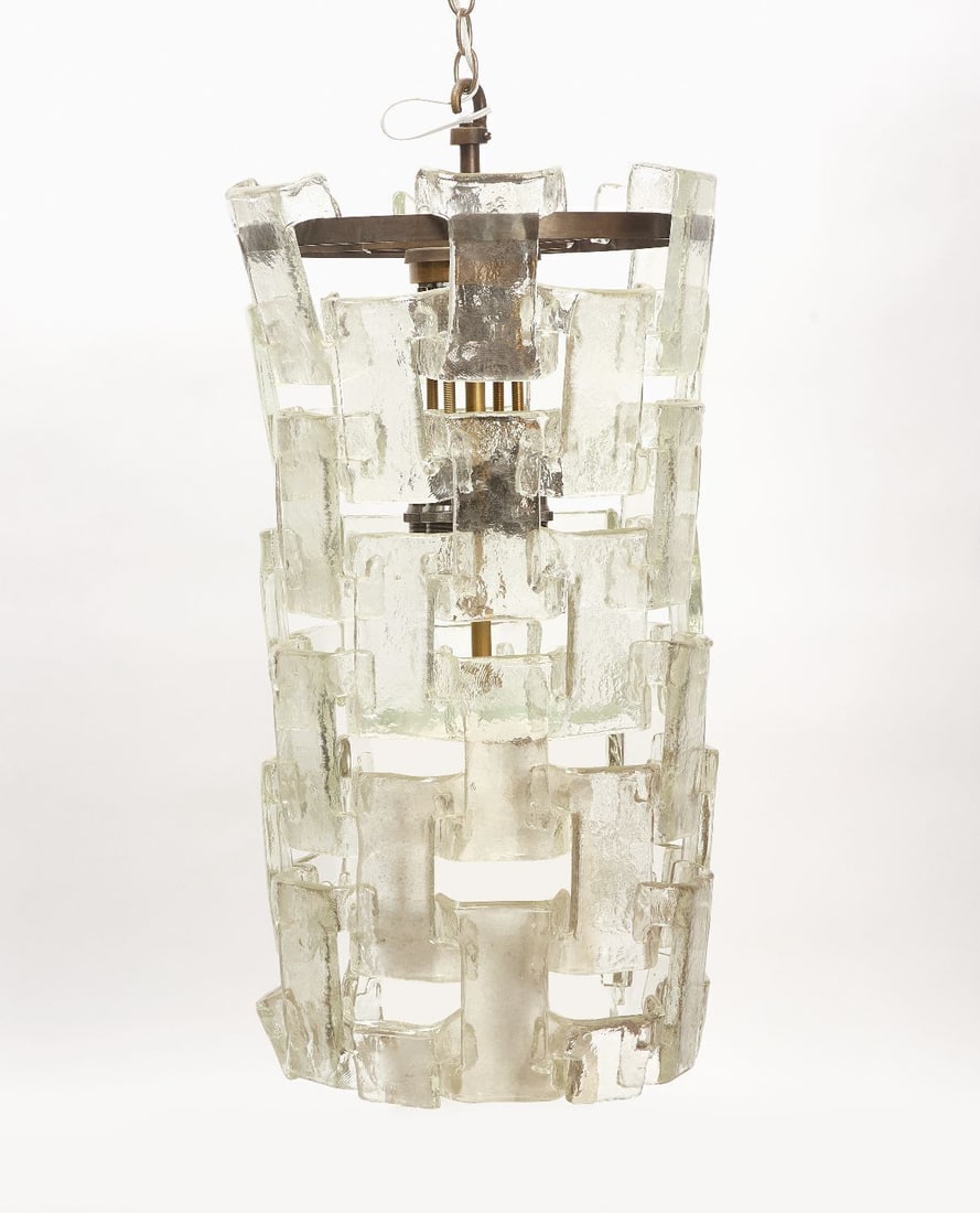 Mazzega Murano Interlocking Glass Chandelier: One modernist ????Mazzega Murana glass chandelier with interlocking elements, and eight light sockets. Includes approx. 60 glass elements and untested bulbs. Murano glass with brass and metal cha