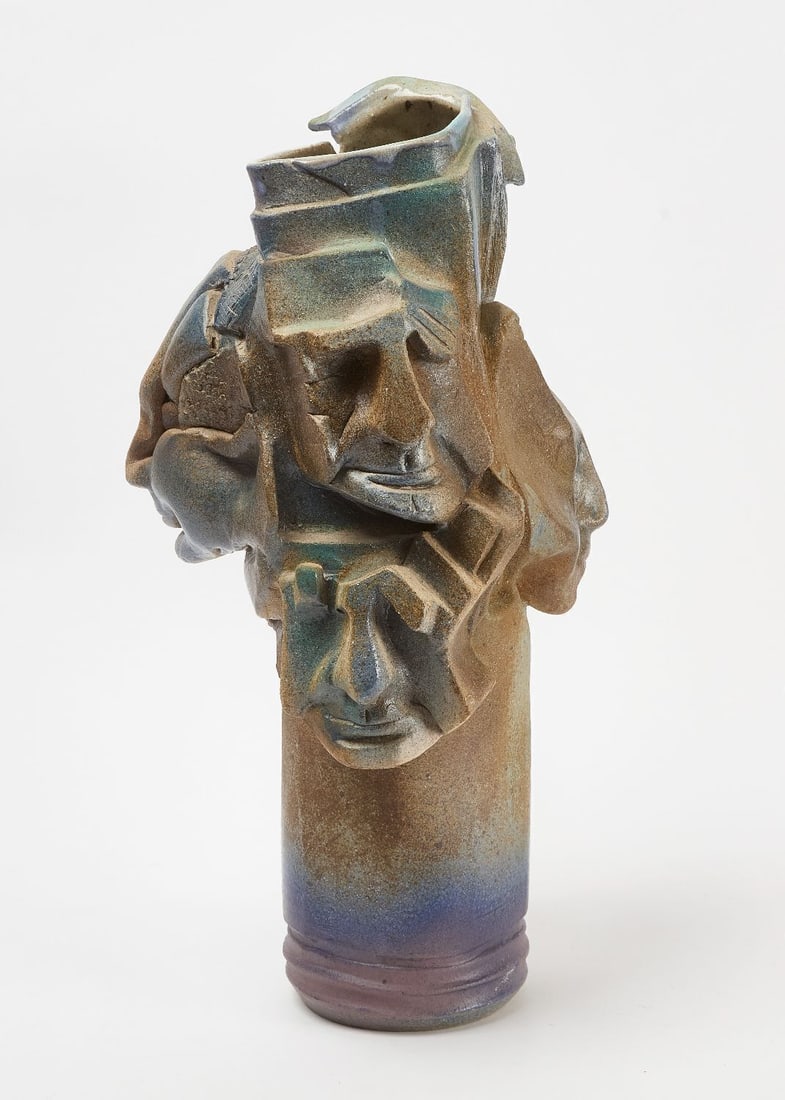Abstract Studio Pottery Vase with Faces: Abstract studio pottery stoneware vase with faces. Hand built and sculpted. Signed LH. American, circa 1965. H 21-1/2 in.
