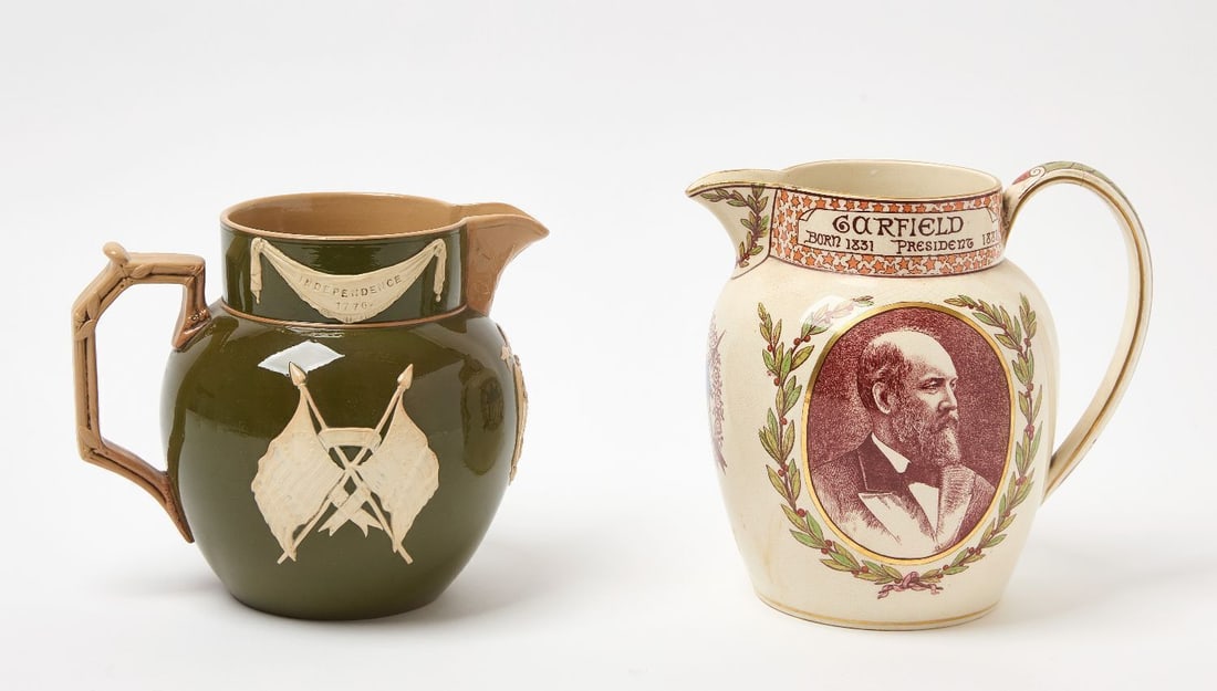 Washington and Garfield Commemorative Pitchers: Washington and Garfield commemorative pitchers. Garfield by Wedgewood. Washington stamped England. Garfield: H 8 in. Washington: H 7-1/2 in.