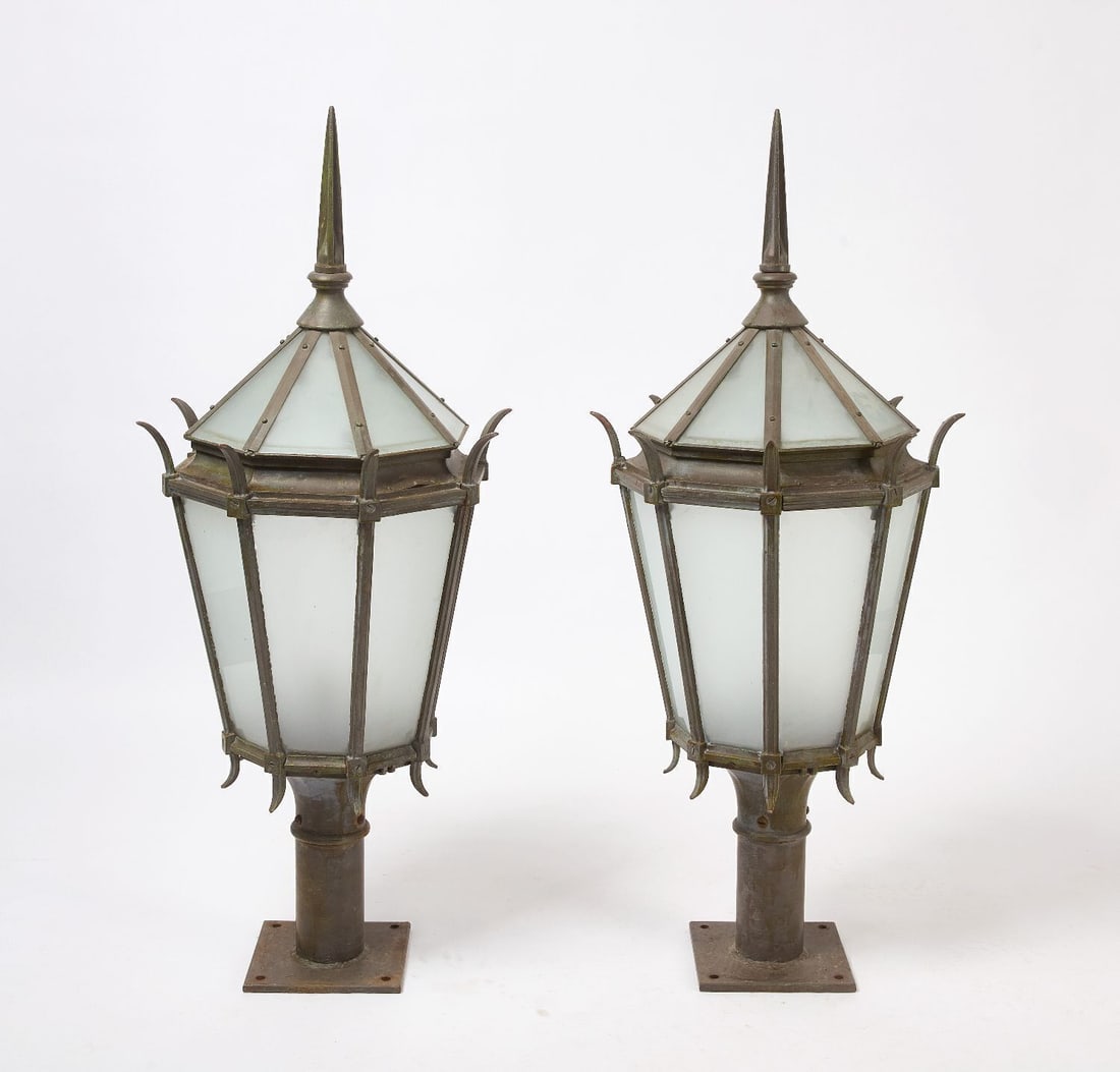 Pair of Outdoor Post Lights: Pair of large outdoor post lights. Hexagonal construction in bronze with frosted glass. Rye, New York, mid-20th century.Overall: H 50-1/2 in. Dia. 21-1/2 in.Post Base: L 9 in. W 9 in.Provenance: