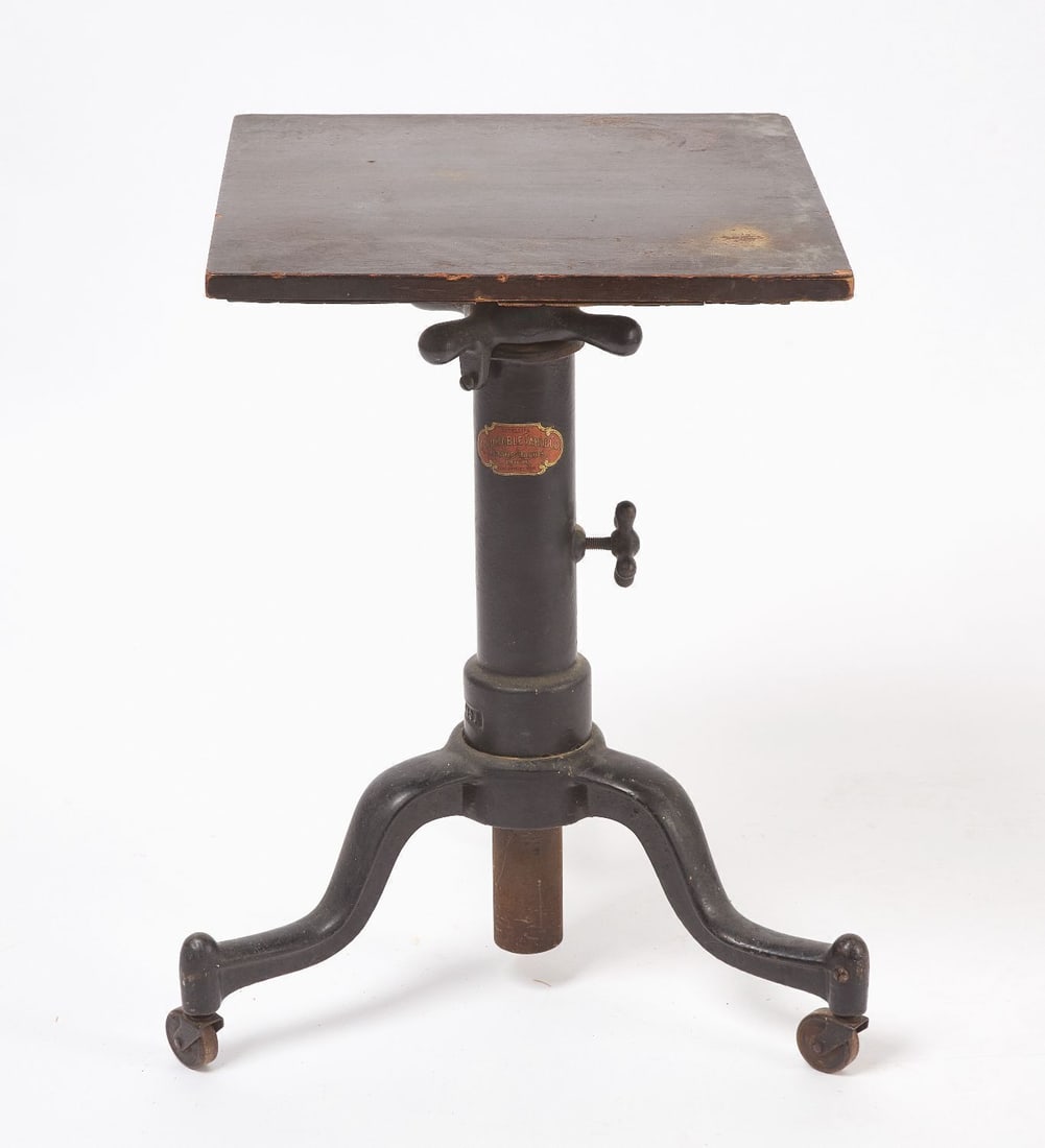 Adjustable Industrial Table: Adjustable industrial table by the Adjustable Table Co. (Grand Rapids, MI). Cast iron with wood top. circa 1920. H 24-1/4 in. (Top) W 16 in. D 16 in.