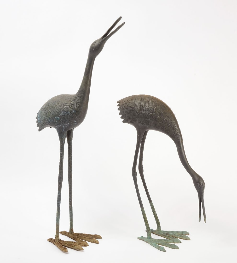 Pair of Cranes: Pair of mid century bronze crane sculptures with verdigris patina. H 21-1/2 in. L 15 in. H 32-1/2 in. L 18 in.