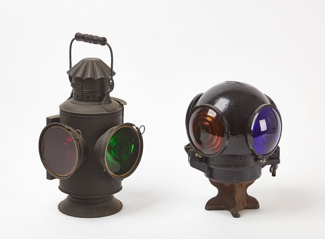 Railroad Switch Lamp and Adlake Signal Lamp: One Adlake railroad signal lamp together with a railroad switch lamp. Original multi-colored lenses to both lamps. Cast iron and tin construction. American, early to mid-20th century.Adlake: H 12-1/4