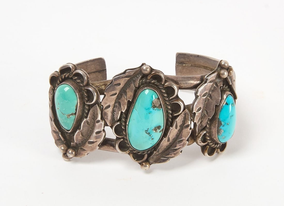 Navajo Feather Silver Cuff Bracelet: Navajo silver and turquoise cuff bracelet with applied feathers. Southwestern US, 20th century. Total Weight: 2.79 ozt. Outer W: 2-3/4 in. Inner W: 2-1/2 in.