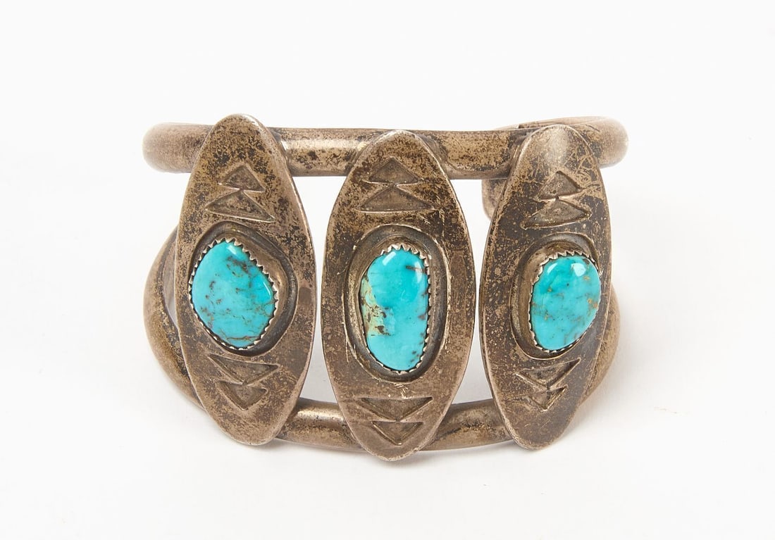 Navajo Silver Cuff: Navajo silver cuff. Sterling, with three inset turquoise cabochons on shield-form plates. Double-strand band. Southwestern US, 20th century. Total Weight: 2.32 ozt. Outer W: 2-1/2 in. Inner W: 2-1/4 i