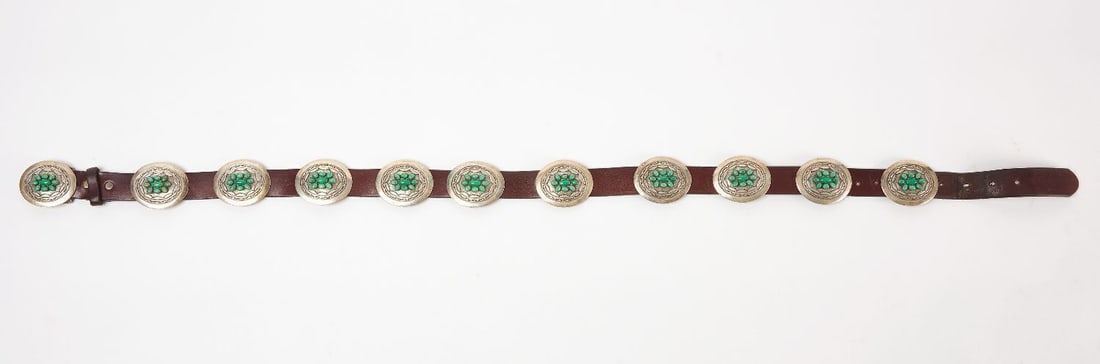 Native American Concho Belt with Turquoise: Native American concho belt with turquoise. Hand-tooled sterling silver with inset oval turquoise stones. Signed on backside of buckle. Southwestern US, mid 20th century. Overall: L 43-1/2 in.