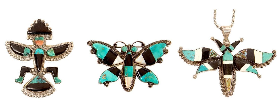 Two Zuni Pins and Moth Necklace: Two Zuni (Native American) silver pins with inlay in various stones (turquoise, jet, red coral, mother-of-pearl, others). Knifewing and butterfly. Together with a moth pin in similar inlay on