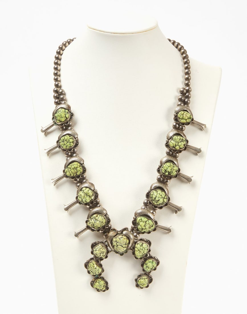 Native American Squash Blossom with Turquoise: Native American squash blossom with seaweed turquoise stones. Southwestern US, circa 1940. Total Weight: 7.505 ozt. L 14-1/4 in. Naja: L 3 in. 