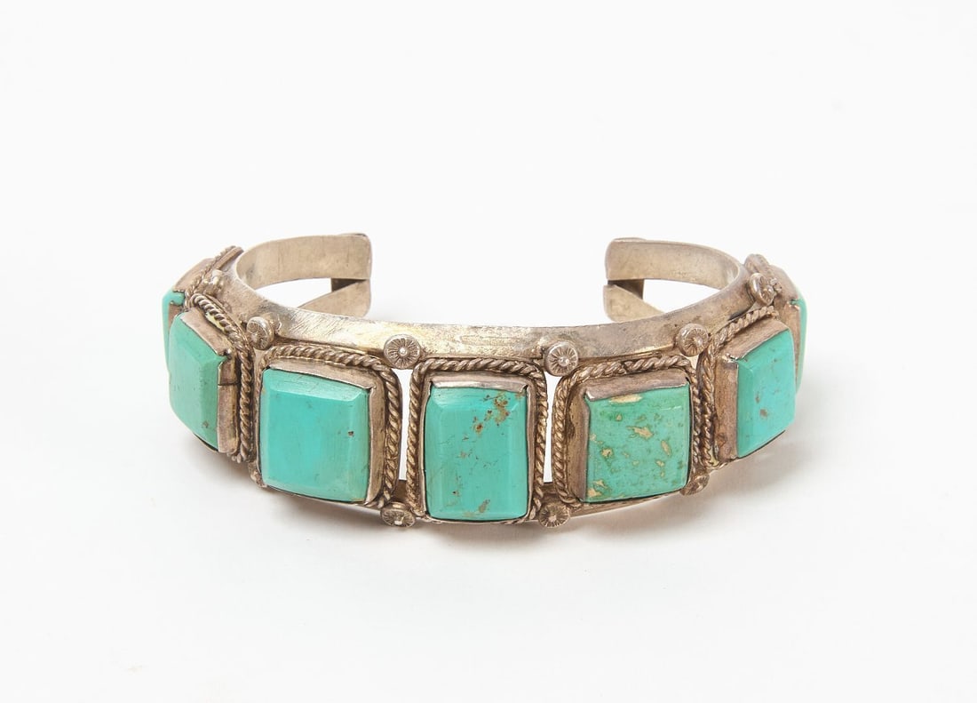 Navajo Cuff Bracelet with Turquoise: Native American Navajo silver cuff bracelet with inlaid rectangular turquoise stones. Southwestern US, circa 1940. Outer W 2-3/4 in. Inner W 2-1/8 in. Weight: 1.725 ozt.