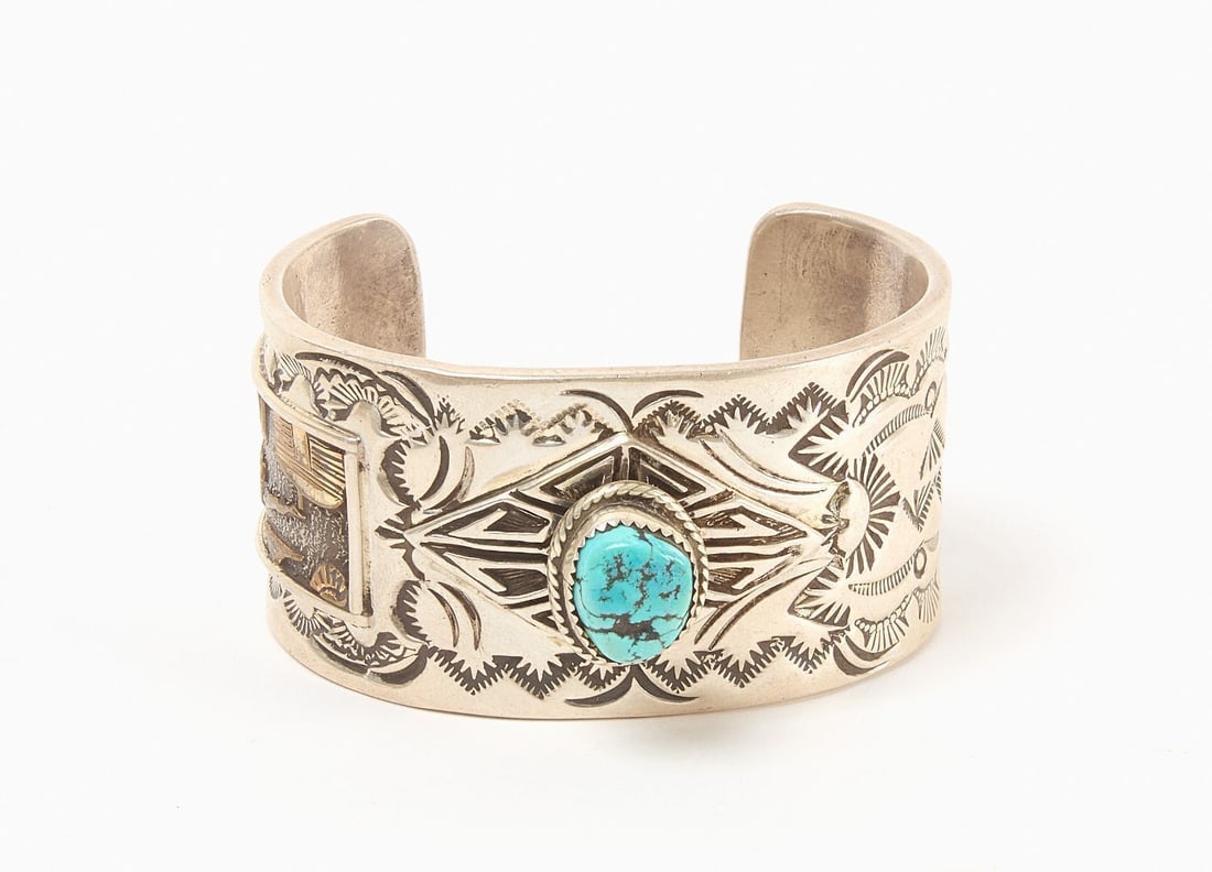 14k and Sterling Navajo Cuff Bracelet: 14k gold and sterling Navajo cuff bracelet with single inset turquoise cabochon. Incised designs on the top of the bracelet. Signed with initial 'N'. Southwestern US, 20th century. Total
