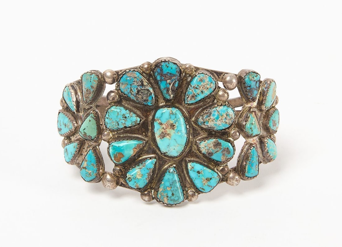 Navajo Turquoise Cuff Bracelet: Navajo (Native American) turquoise cuff with inset turquoise cabochons. Southwestern US, circa 1940. Total Weight: 1.375 ozt. Outer W: 2-3/4 in., Inner W: 2-1/4 in.