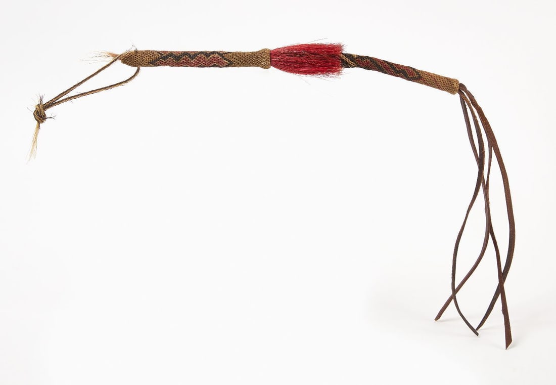 Native American Horse Hair Quirt: Native American Horse Hair Quirt. Horse hair hitch knotting in geometric designs in red and black, with leather tassles. Late 19th to early 20th century. L 30 in. 
