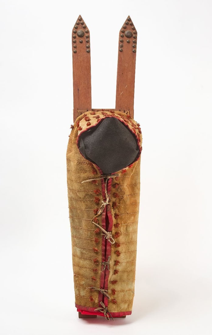 Papoose Carrier: Papoose carrier. Quillwork on hide. Red cloth binding and wooden carrier with brass tacks. Plains region, 19th century. L 39 in. W 9-1/2 in.