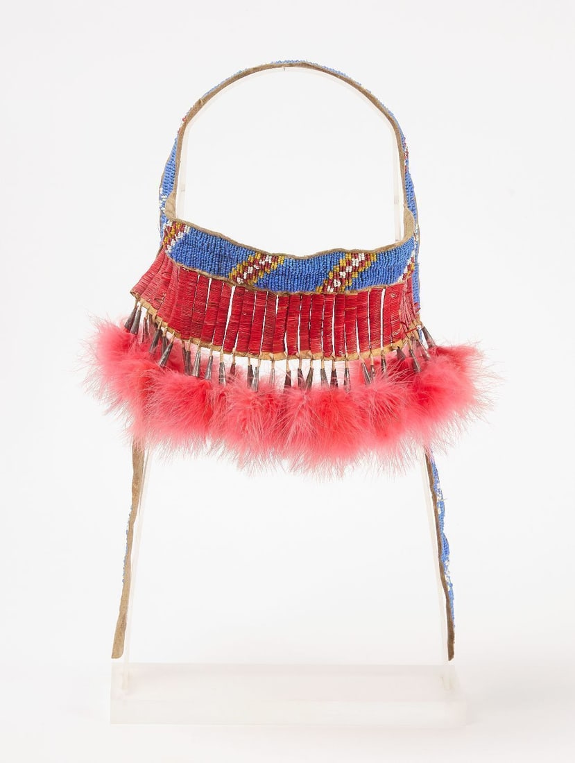 Beaded Horse Headstall: Horse headstall. Beadwork on hide with quill work and tin cones. Plains region, circa 1900. Professionally mounted. H 18 in. in stand.