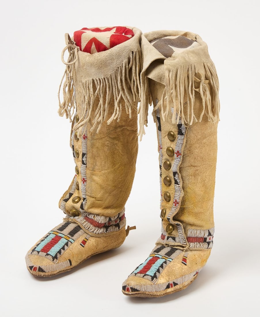 Pair of High-Top Moccasins: Pair of high-top moccasins. Glass beads and brass studs on hide. Sinew sewn. Plains region. Early 20th century . H 15 in. L 9 in.