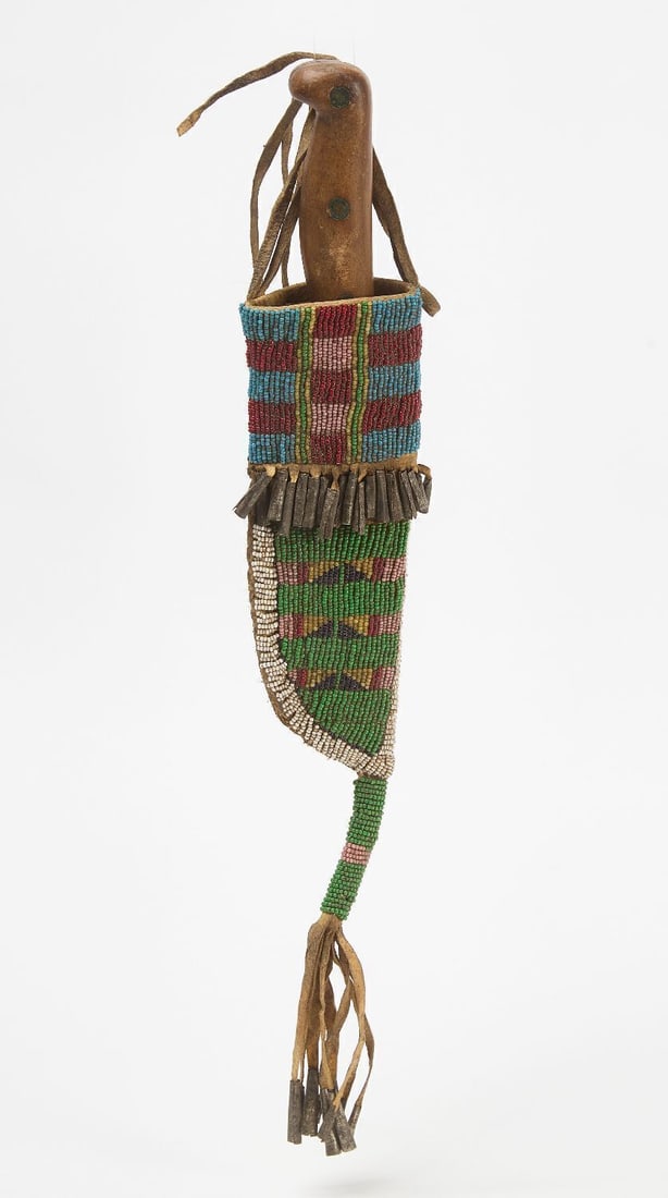 Native Knife Sheath: Native knife sheath. Beadwork a on hide. Sinew sewn. Knife included. Plains region, circa 1895. L with drop: 15 in.