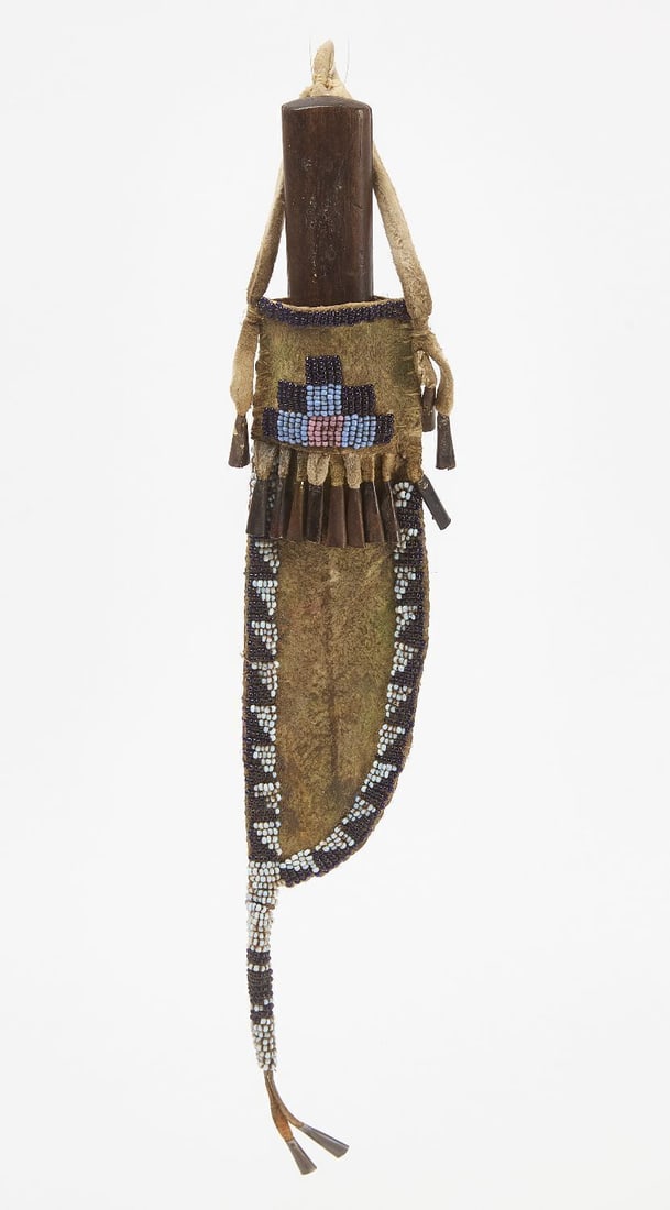 Native Parfleche Beaded Knife Sheath: Native parfleche beaded knife sheath. Glass beadwork on hide with tin cones. Sinew sewn. Circa 1900. L with tail: 12 in.