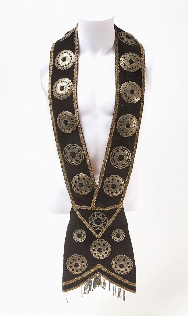 Bandolier Bag: Native American velvet bandolier bag with decorative silver-plated copper ornaments. 20th century. L 38-1/2 in. W 9-1/2 in.
