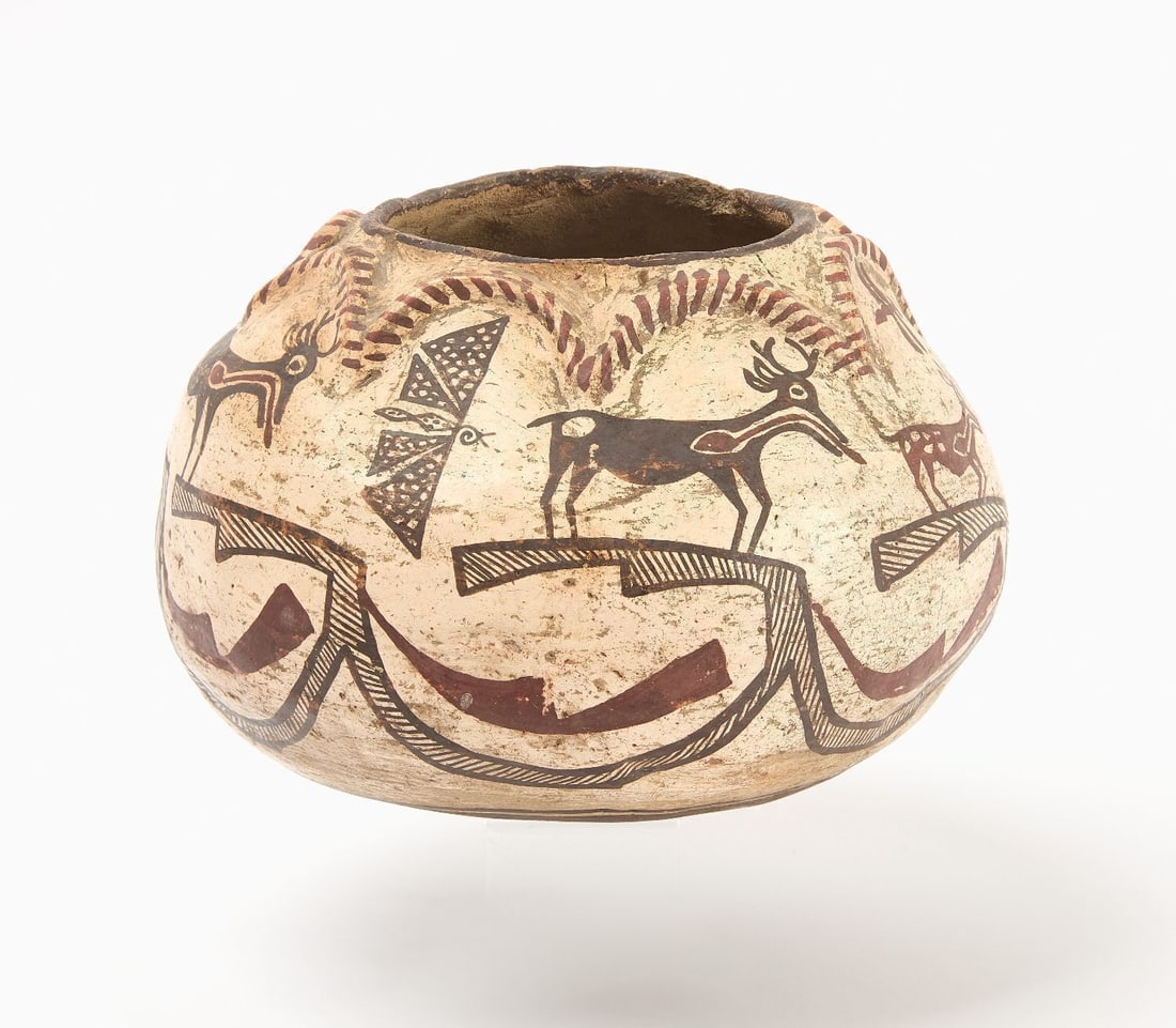 Pictorial Native Polychrome Olla: Pictorial Native American polychrome olla with butterfly and deer figures. Raised segments adorn the outer top edge of the olla. Slightly convex base. Pueblo or Zuni, mid 19th century. H 6-1/8 in.