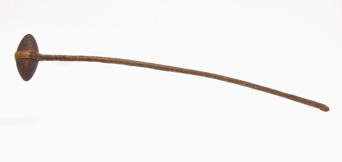 Native American Skull Cracker: Native American skull cracker. Stone head with wrapped rawhide over wood handle. Plains Region, 19th century. Overall: L 32-3/4 in. Head: L 5-1/8 in.