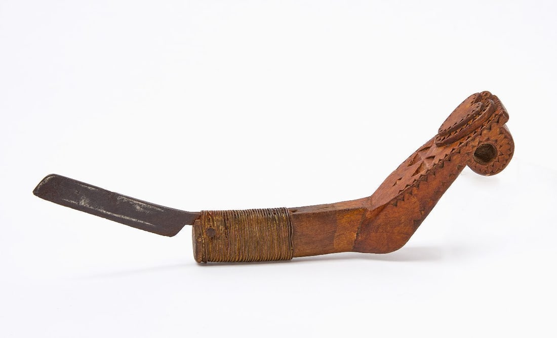 Mi'kmaq Crooked Knife with Heart: Mi'kmaq crooked knife with heart. Carved wood with chip-carved designs, copper wire, iron nails, re-worked steel trade blade. Velvet under wrapping. Circa 1865-1875. L 9-7/8 in.