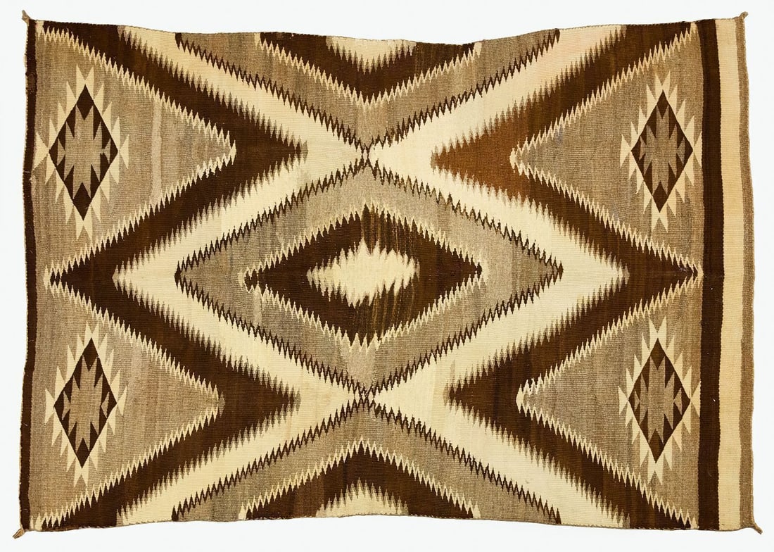 Navajo Sawtooth Weaving: Navajo weavingin tan and brown with sawtooth or serrated edge motifs. Southwestern US, circa 1900. (Approx): L 85 in. W 59 in.