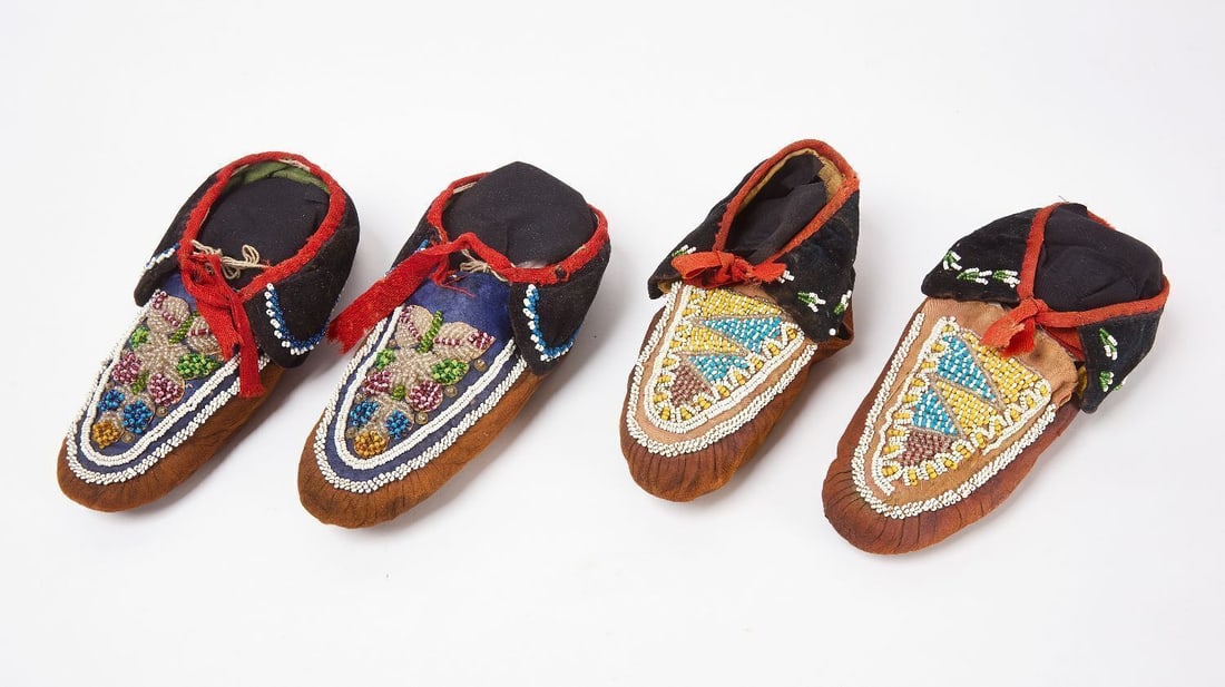 Two Pairs of Great Lakes Moccasins: Two pairs of Native Great Lakes moccasins. Glass beads on fabric and hide. Early 20th century. L 10 in. Each.