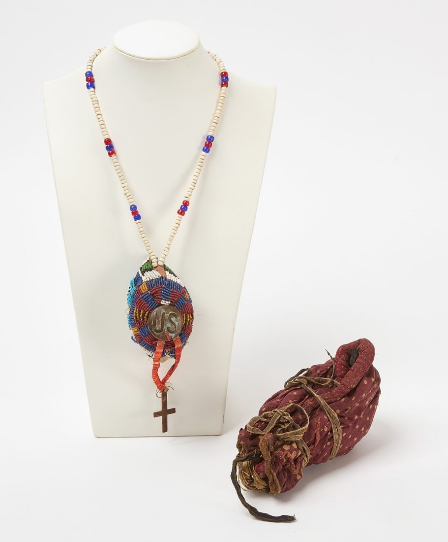 Two Sioux Medicine Bundles: Two Native American medicine bundles. Sioux, circa 1890-1910. L 18 in. L 8 in.