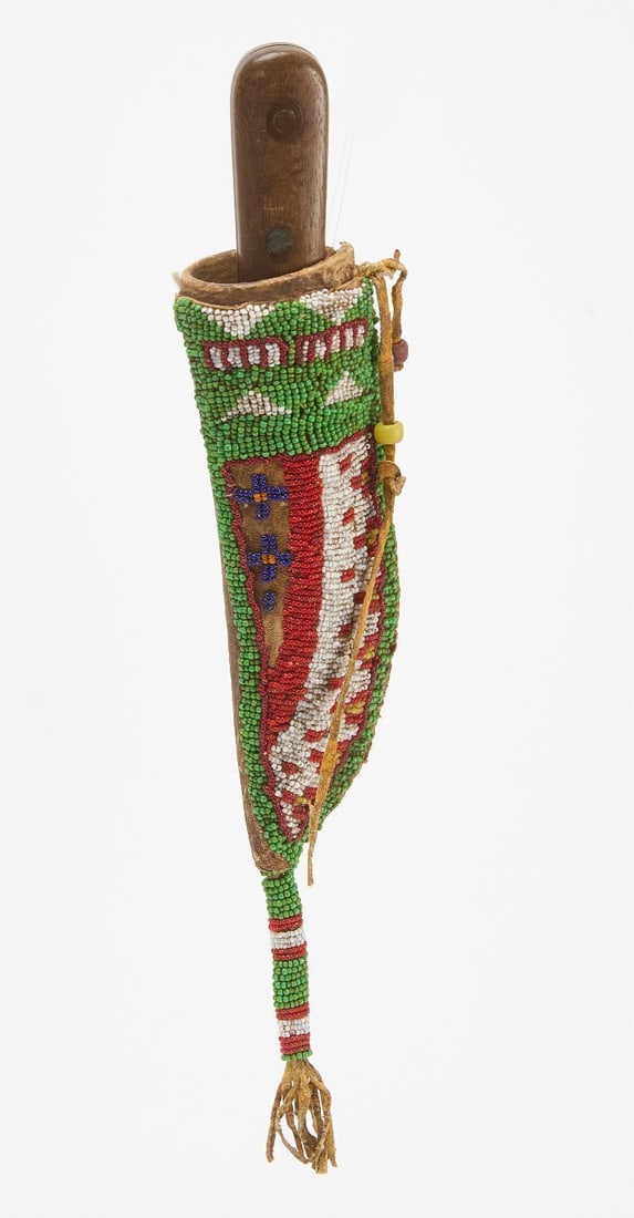 Parfleche Beaded Knife Sheath: Parfleche beaded knife sheath. Sinew sewn. Circa 1915. L with tail: 11-1/4 in.