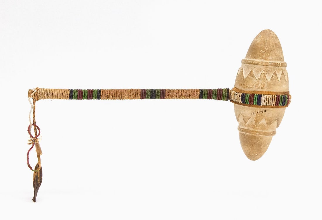 Native American Skull Cracker with Beadwork: Native American skull cracker. Carved stone with beadwork handle. circa 1880. Overall: L 13 in. Stone: L 6-3/4 in.
