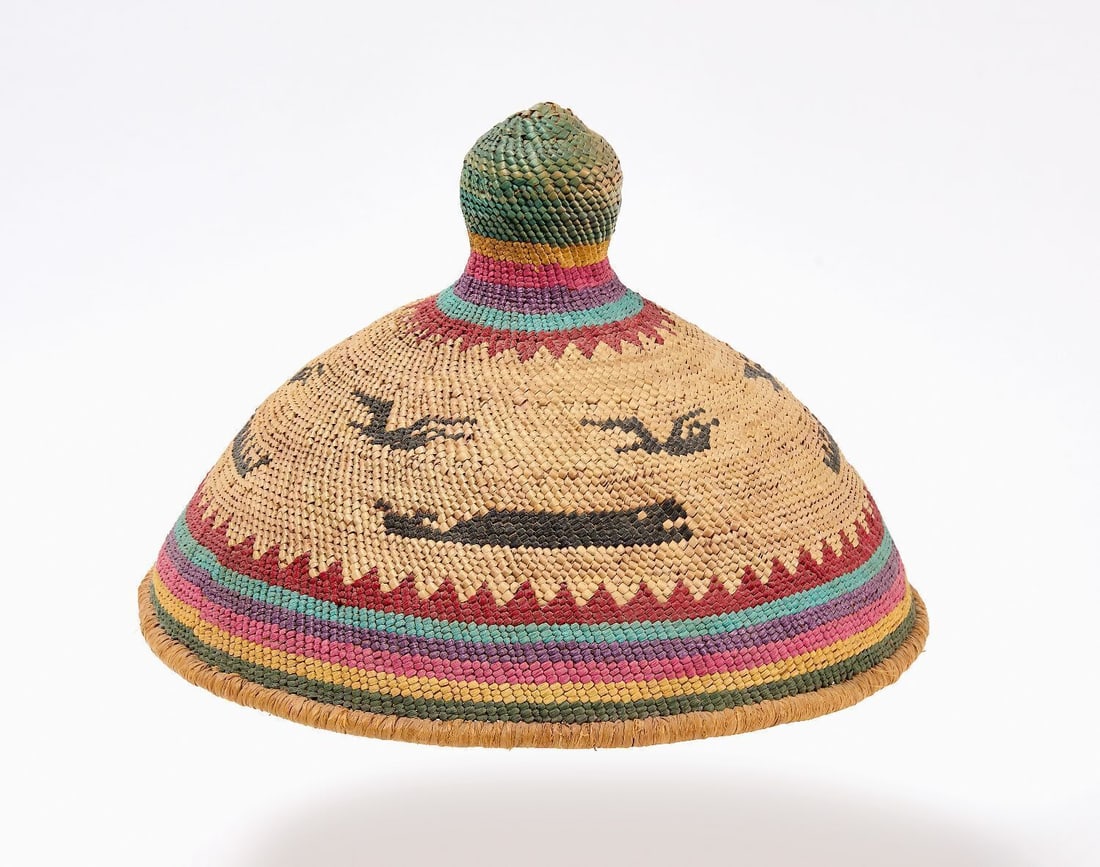 North West Coast Native Whalers Hat: North West coast Native whalers hat. Conic form with whale, bird, and wave motifs and multi-colored decorative borders. Northwestern coast. Circa 1925. H 7-1/4 in. Dia. 11 in.