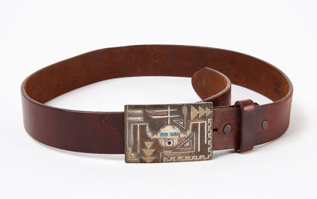 Ric Charlie Tufa Cast Silver Belt Buckle: Ric Charlie (signed on backside of buckle with inital 'R'), tufa cast silver (XRF tests 94%) belt buckle with leather belt. Southwestern US, contemporary. Overall: L 37-3/4 in. Belt Buck