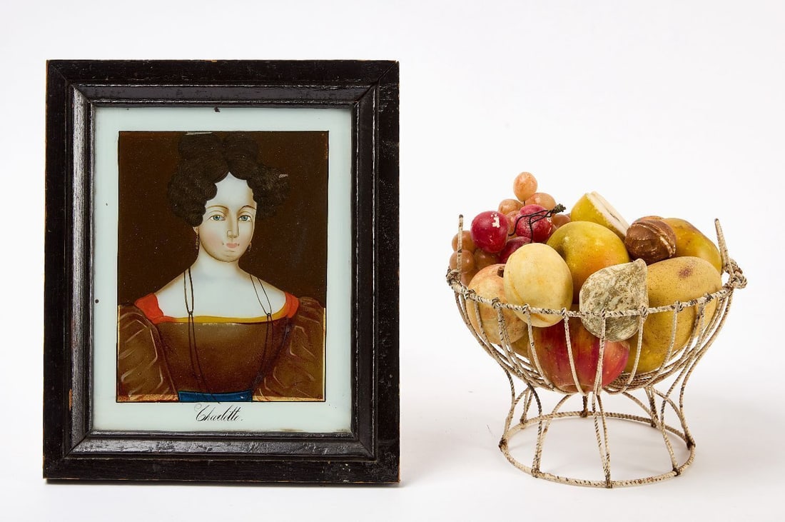 Stone Fruit with Wire Basket and Reverse Glass Portrait: One wire basket with 15 hand-painted stone fruit, and one export reverse glass portrait of a woman. Sitter's name "Charlotte" painted to bottom center of portrait. Europe, 19th century.