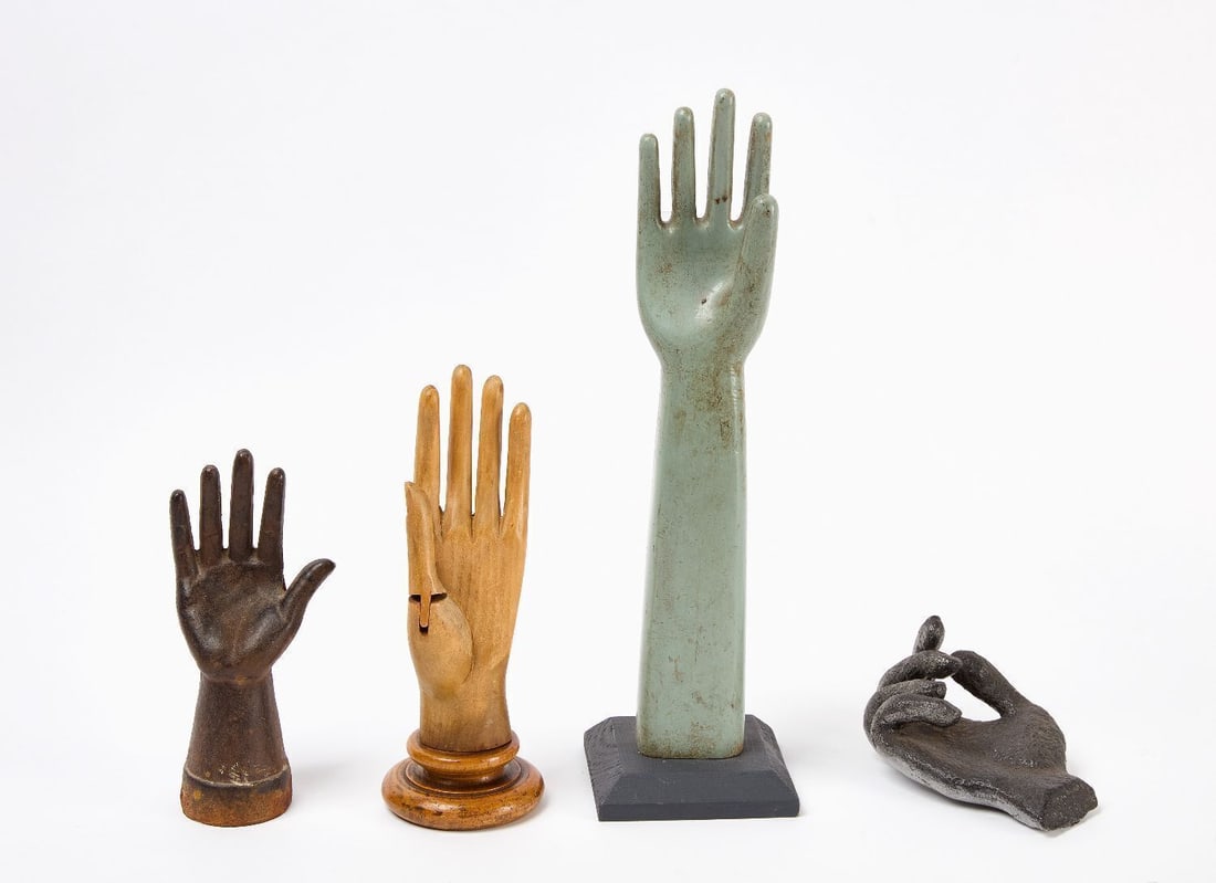 Group of Four Hand Forms: Grouop of four hand forms. Including a wood glove for articulated example, A wooden glove mold painted blue- grey, and two cast iron hand whimsies. All ealry 20th. Gove form: H 10-1/2 in. Glove
