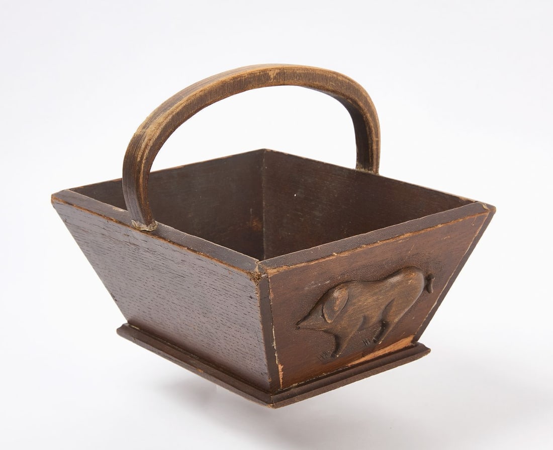 Carved Truffle Hunting Basket with Pig: Carved Truffle Hunting Basket. Features a carved pig motif to one side. Carved wood in assembled components. H 8-7/8 in. W 12 in. D 9 in.