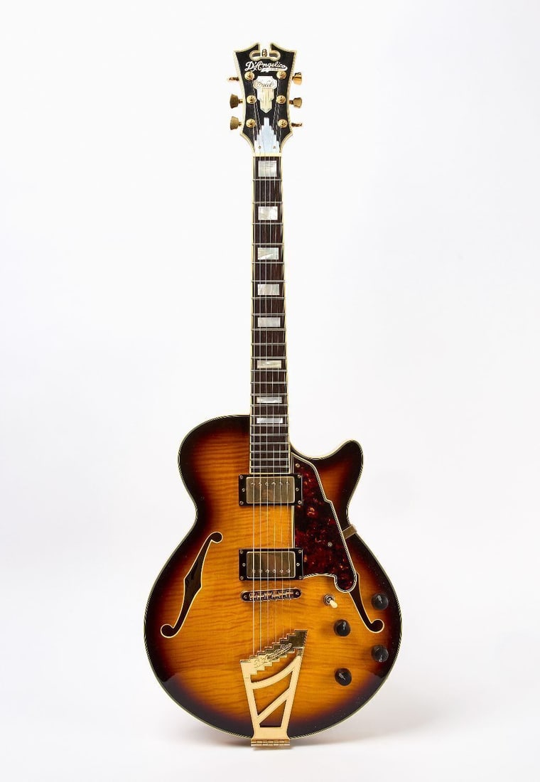 D'Angelico Electric Guitar: D'Angelico electric guitar. Model EX-SS. Serial number US15010146. Orignal case.