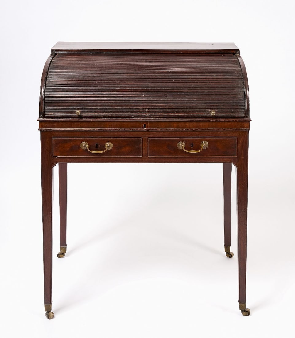 Tambour Front Regency Desk: Regency desk with tambour lid. Original brass castors and hardware. English, circa 1810. H 38 in. W 29-3/4 in. D 22 in.