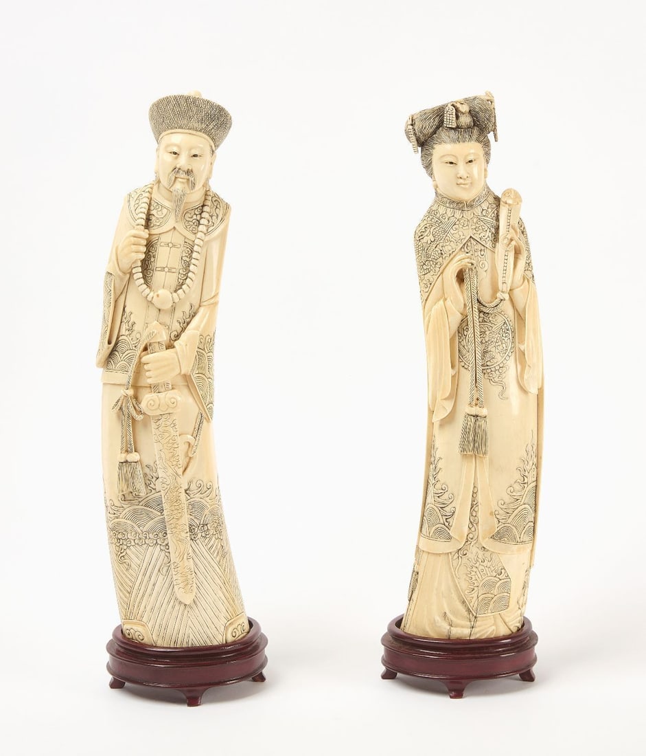 Pair of Qing Dynasty Royal Carved Figures: Pair of Qing Dynasty royalty figures. Carved bone on custom wood stands. Signed underneath bottoms. China, 20th century. H 14-1/2 in.