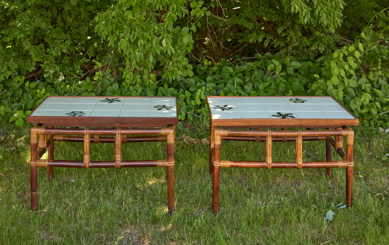Two Ficks Reed Mid-Century Bamboo Side Tables: Two Mid-Century Bamboo Side Tables. Part of John Wisner's "Far Horizons" collection for Ficks Reed. Original tile. Mid-20th century.H 20 in. W 18-3/4 in. D 30-7/8 in.