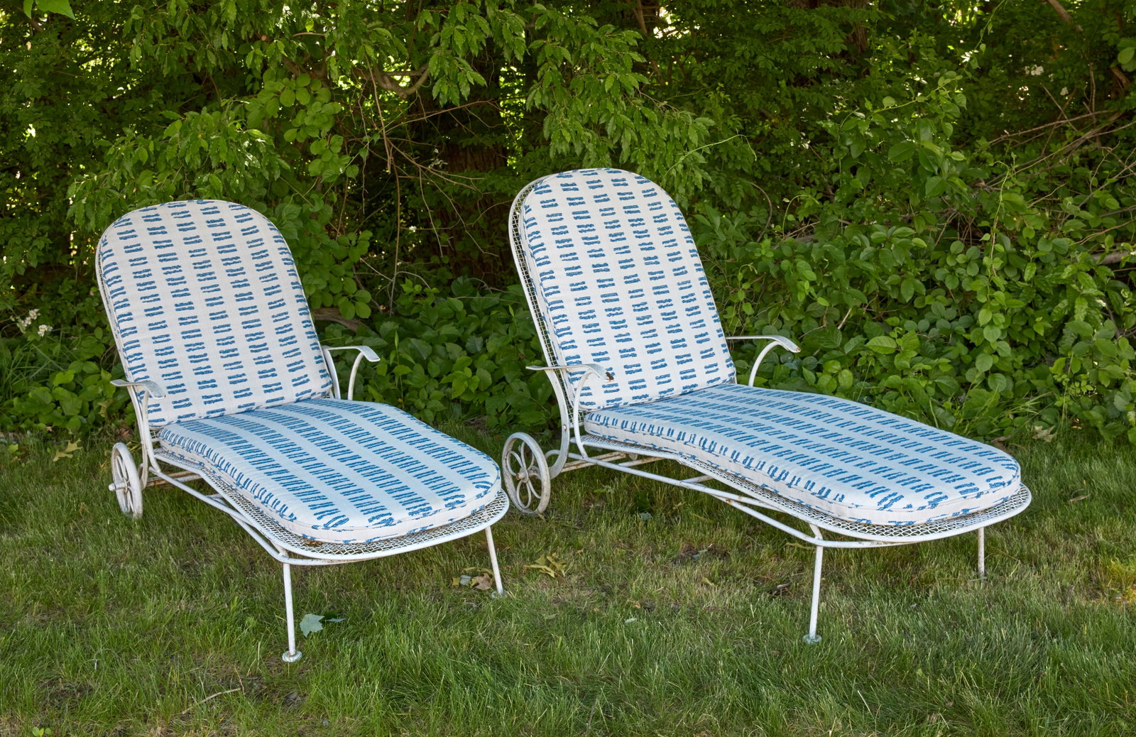 Pair of Outdoor Sculptura Chaise Lounges: Russell Woodard (1914–1983) Pair of Outdoor Sculptura Chaise Lounges. White enameled wrought iron with custom upholstery. American, mid-20th century.H (as photographed) 36-3/4 in. W 25 in. L 71 in.