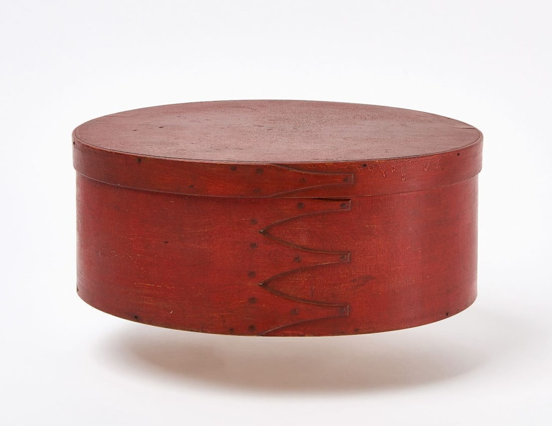 Shaker Oval Pantry Box in Red Paint: Shaker 4-finger oval pantry box in old likely original red paint. New England, mid to late 19th century. H 4-7/8 in. W 12 in. D 8-3/8 in.
