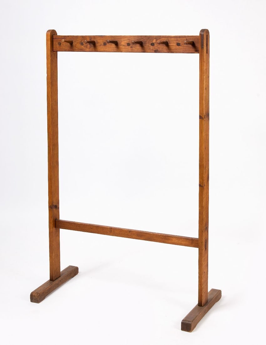 Shaker Cloak Rack: Shaker Cloak Rack. Pine. Six hanging knobs. Morticed shoe foot. American, 19th century. H 55-1/2 in. W 34-3/4 in. D 15-1/2 in. 